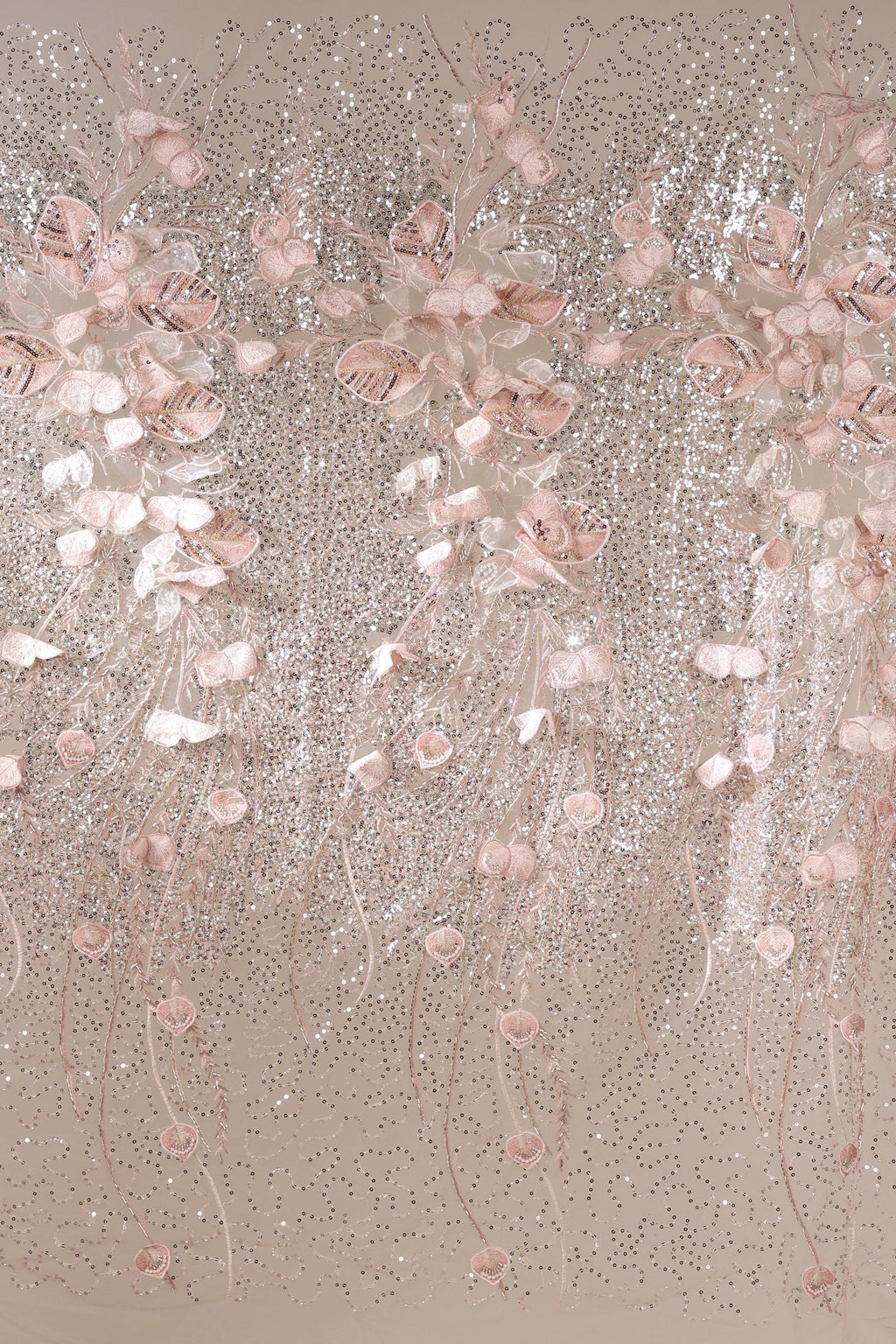a decorative arrangement of pink and white flowers, with delicate petals and stems cascading down in a flowing, cascading pattern. The flowers are arranged in a way that creates a sense of movement and elegance, with the pink and white hues contrasting beautifully against the neutral background.