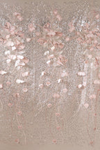 a decorative arrangement of pink and white flowers, with delicate petals and stems cascading down in a flowing, cascading pattern. The flowers are arranged in a way that creates a sense of movement and elegance, with the pink and white hues contrasting beautifully against the neutral background.