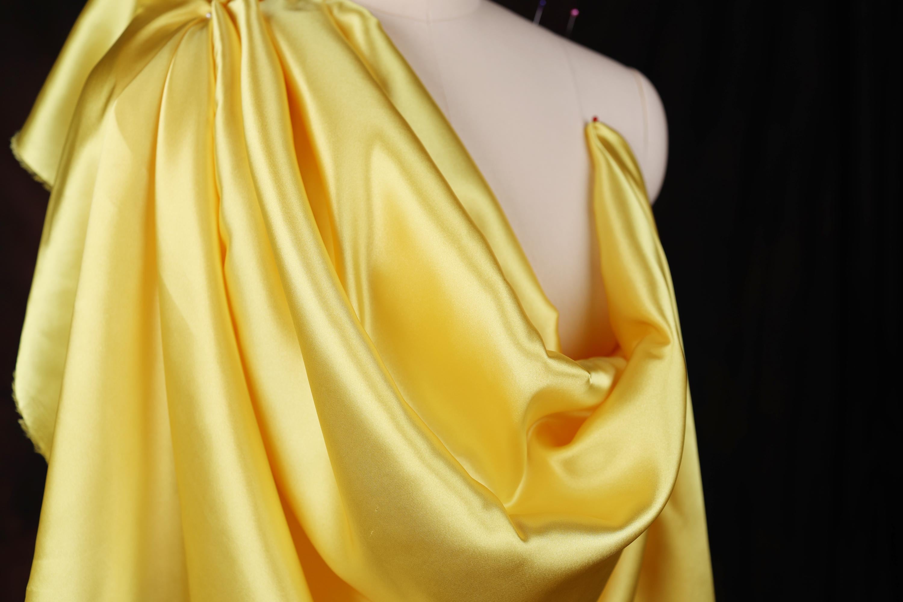 a mannequin with a yellow dress on it