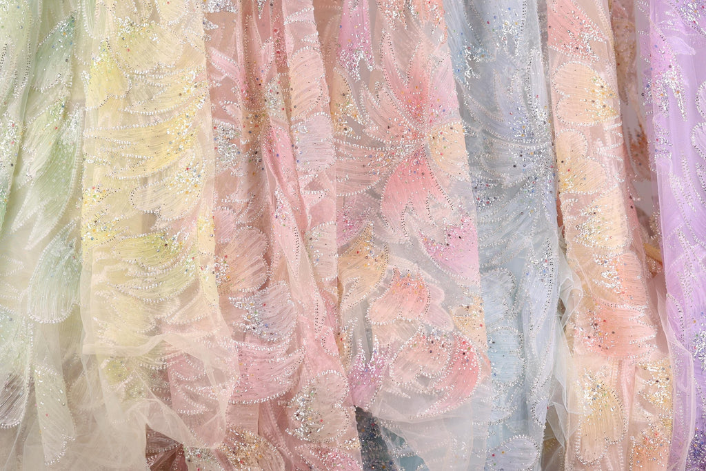 a variety of colorful, patterned fabric swatches, showcasing different textures and designs.