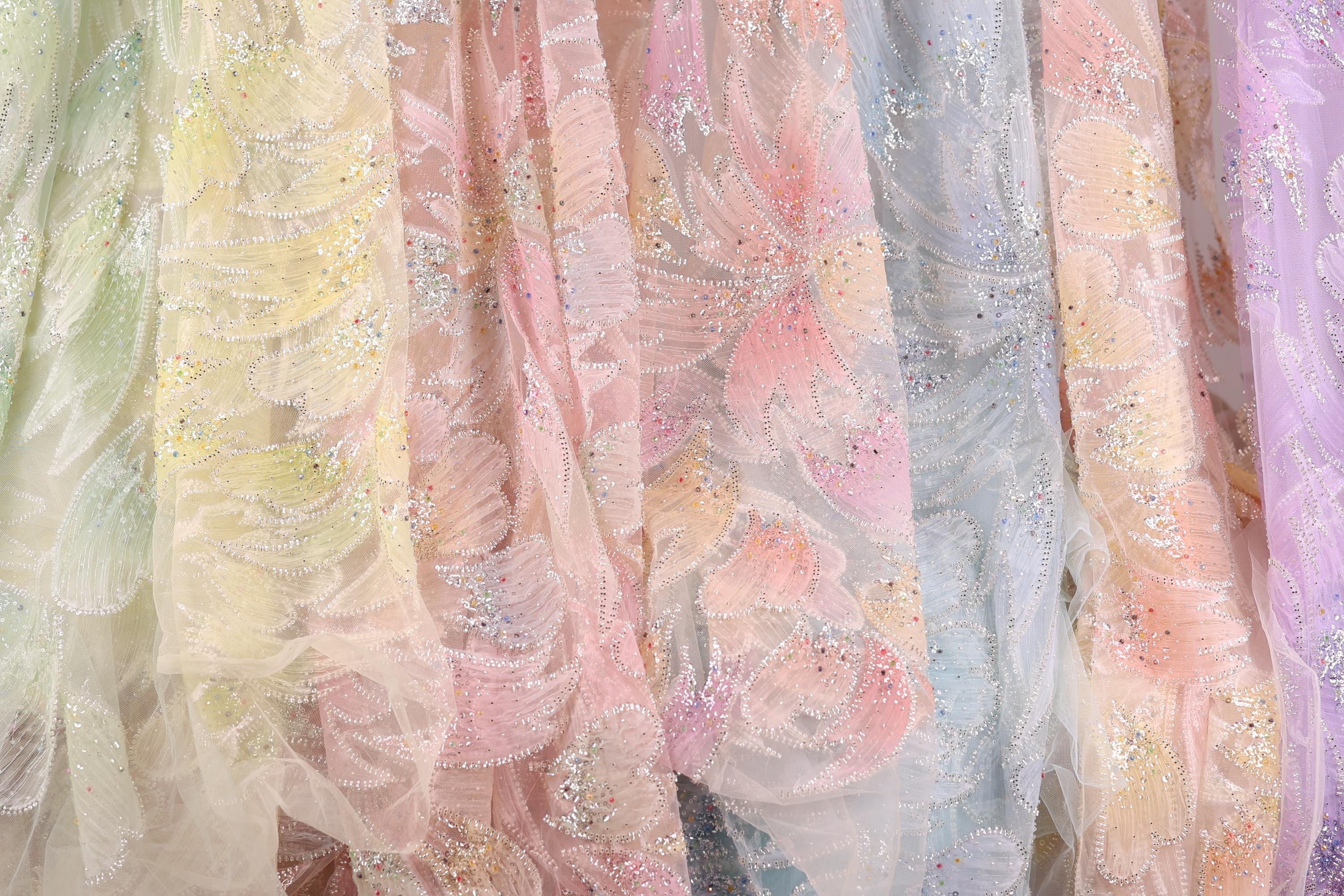 a variety of colorful, patterned fabric swatches, showcasing different textures and designs.