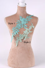 A mannequin with a floral lace design on its bust, featuring two distinct styles.