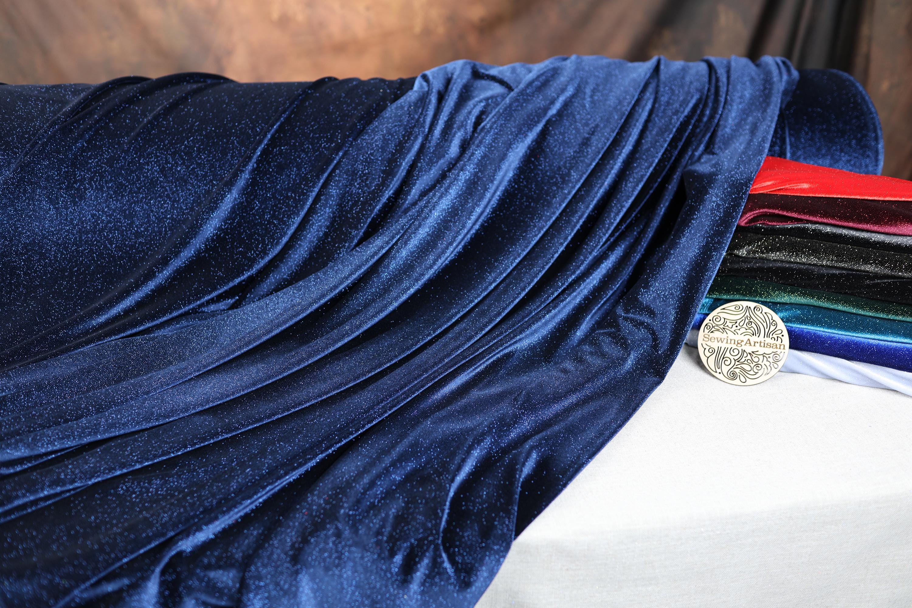 a close up of a cloth with a coin on it