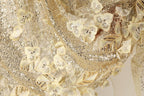 The image is a close-up of a delicate, shimmering fabric with a floral pattern. The fabric is adorned with numerous small, intricately designed flowers and sequins, creating a visually striking and elegant appearance.