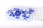 a clear ruler with a blue floral design on it.