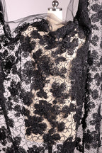 a black and white floral pattern with a lace-like texture, creating a visually striking and intricate design.