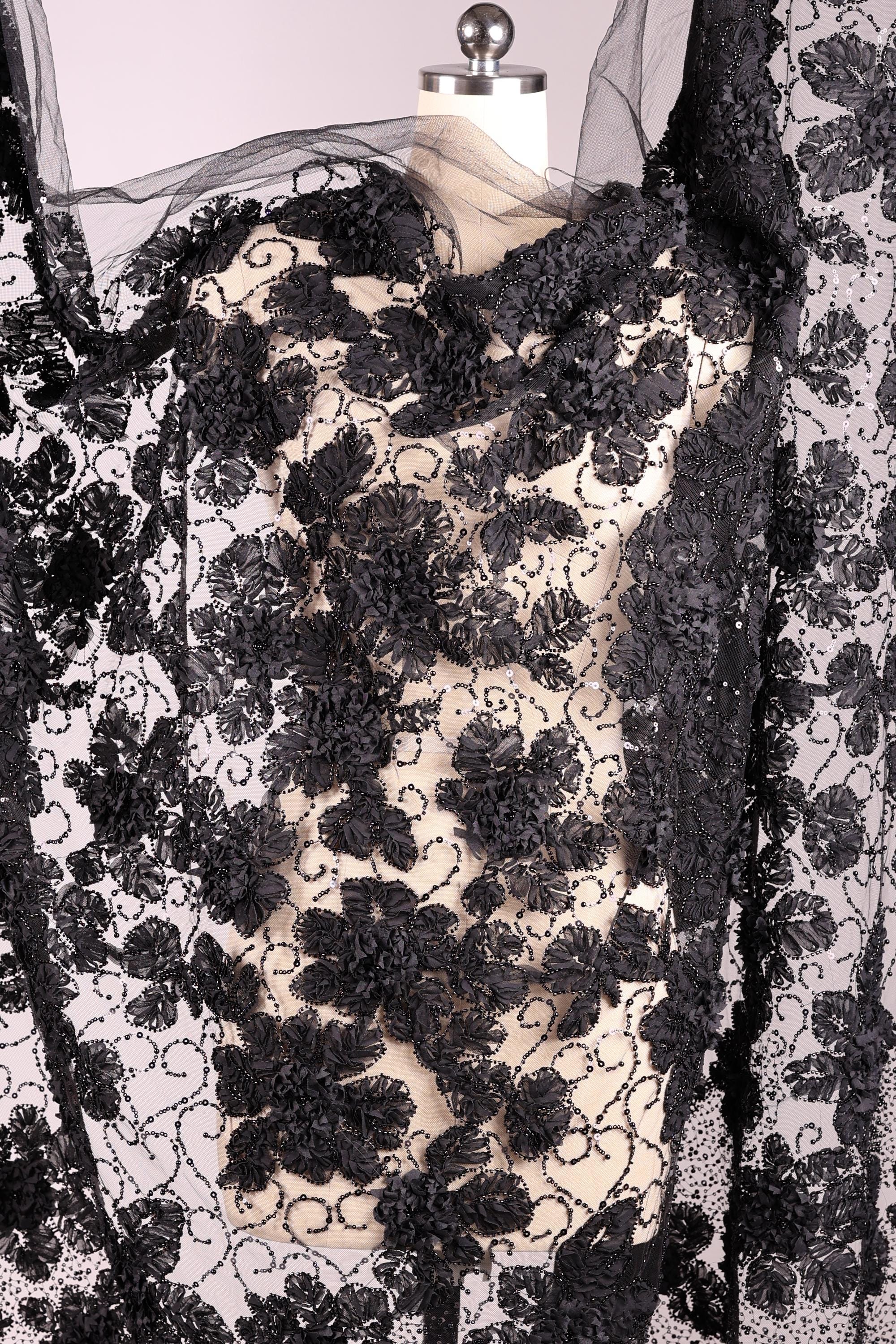 a black and white floral pattern with a lace-like texture, creating a visually striking and intricate design.