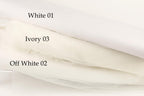 three different shades of white fabric, each labeled with a number.