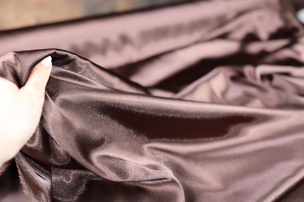 a person holding a piece of cloth in their hand