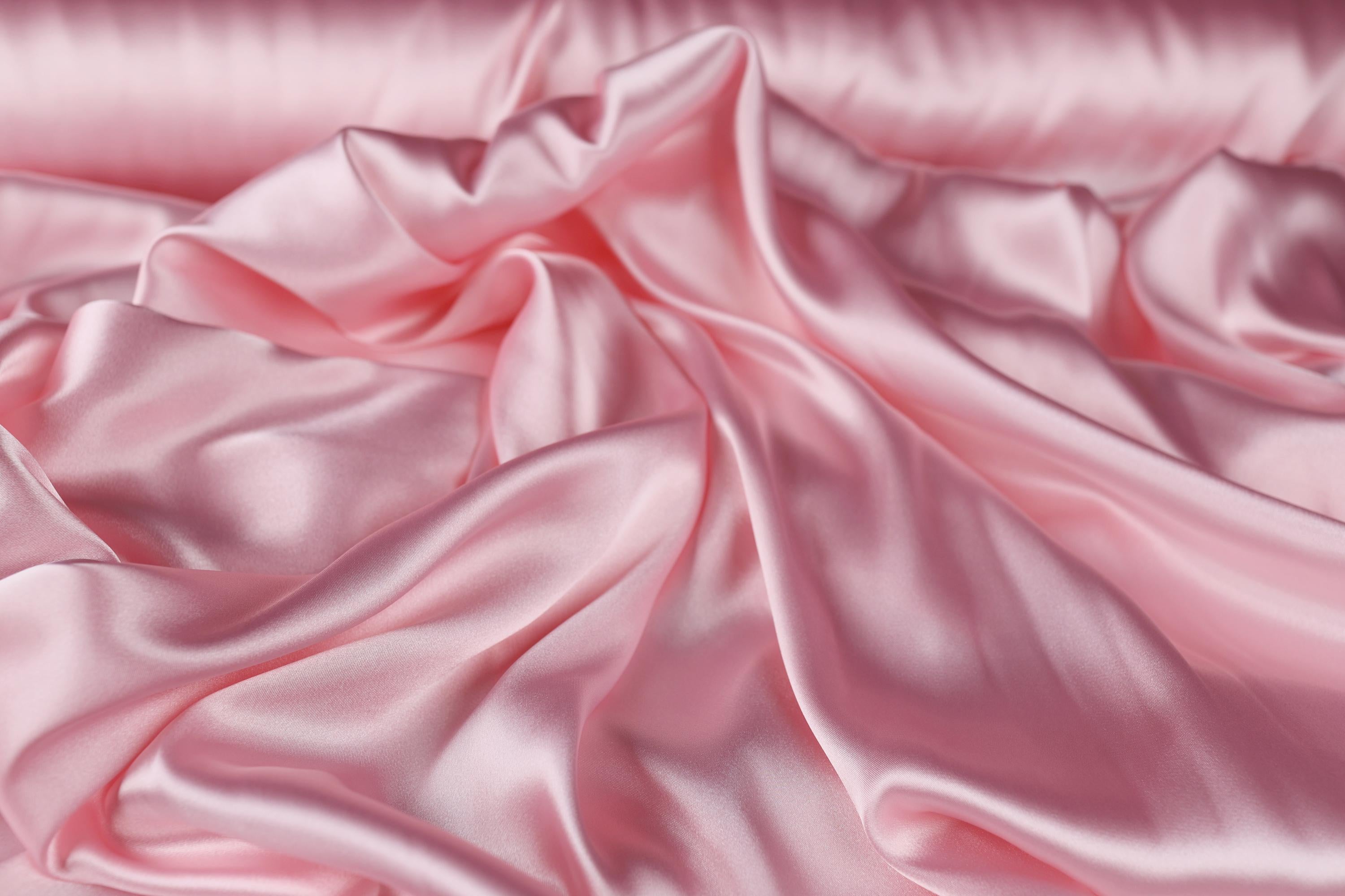 a close up of a pink satin fabric