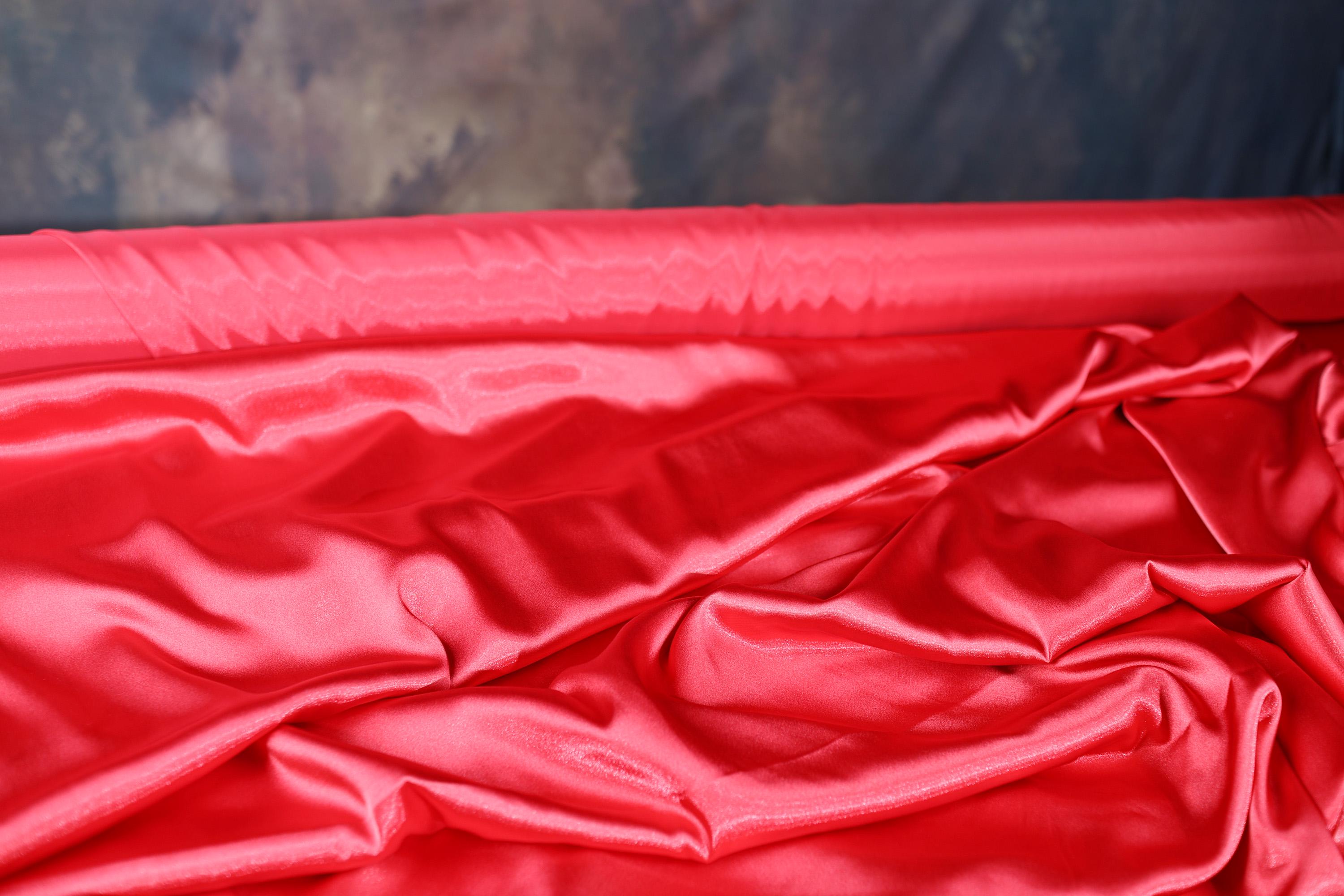 a red cloth with a black background
