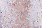 The image is a collage of various floral patterns and designs, including flowers, leaves, and other natural elements, all set against a soft, pastel-colored background.