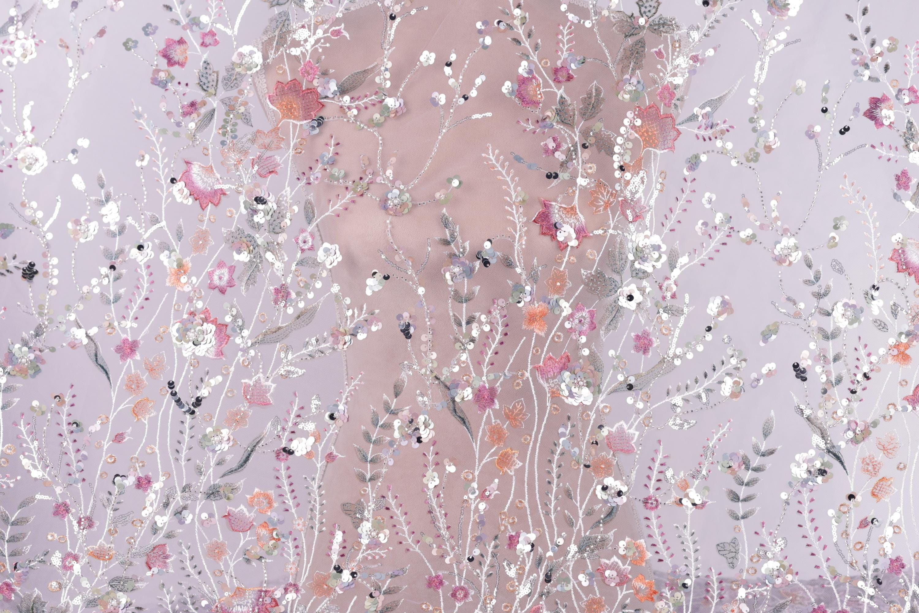 The image is a collage of various floral patterns and designs, including flowers, leaves, and other natural elements, all set against a soft, pastel-colored background.