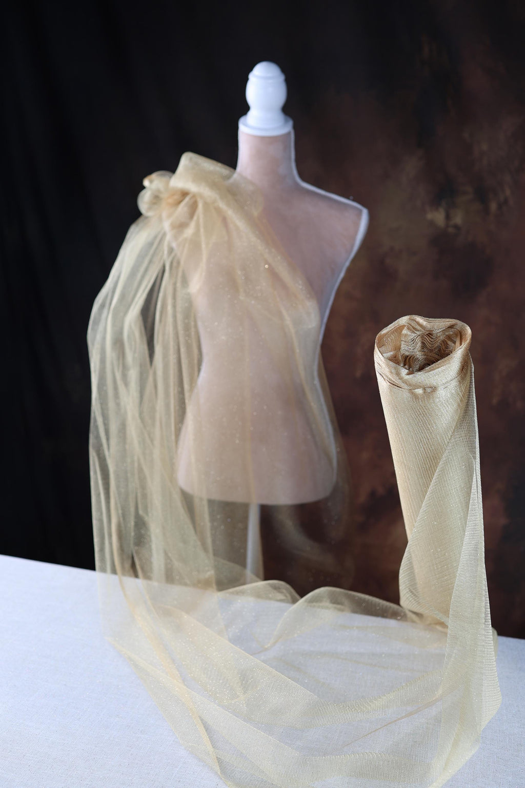 a mannequin with a veil on top of it
