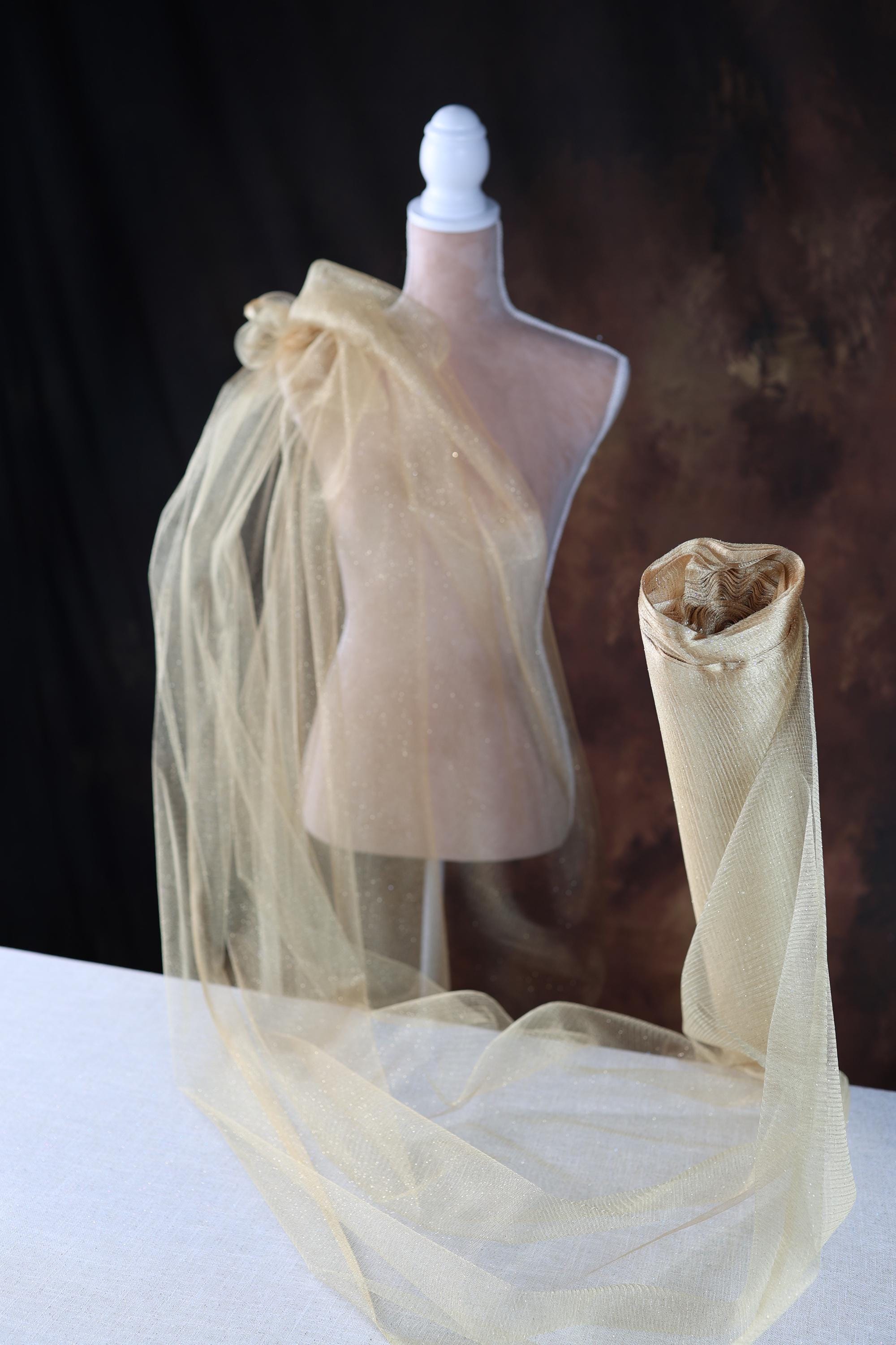 a mannequin with a veil on top of it