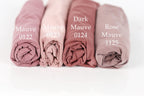 Four rolled-up fabric swatches in different shades of pink, labeled with the names of the colors: Mauve, Dark Mauve, Rose Mauve, and Mauve 0122.