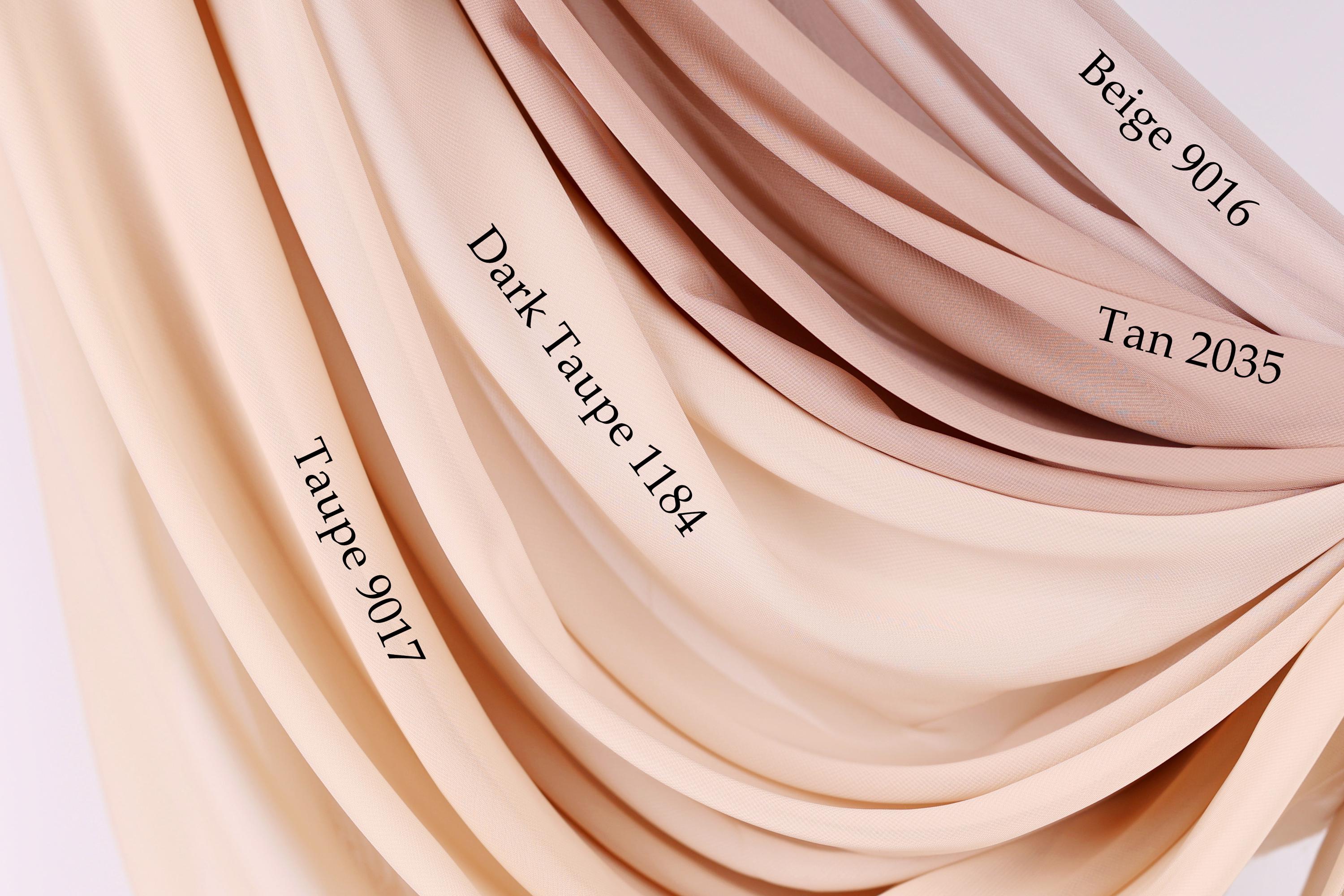 a close-up view of a fabric with different shades of beige, ranging from light to dark. The fabric appears to be a sheer or sheer-like material, with the colors transitioning smoothly from light to dark. The image does not contain any text, and the focus is on the fabric's color variations.
