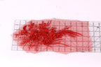 a red floral design with numerous red flowers and leaves, arranged on a transparent surface.