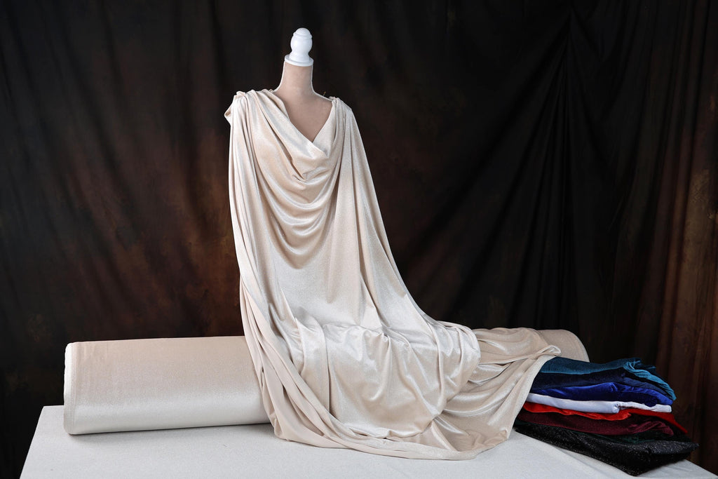 a mannequin is draped over a sheet of fabric