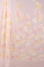 a pattern of pink and yellow flowers on a light pink background.
