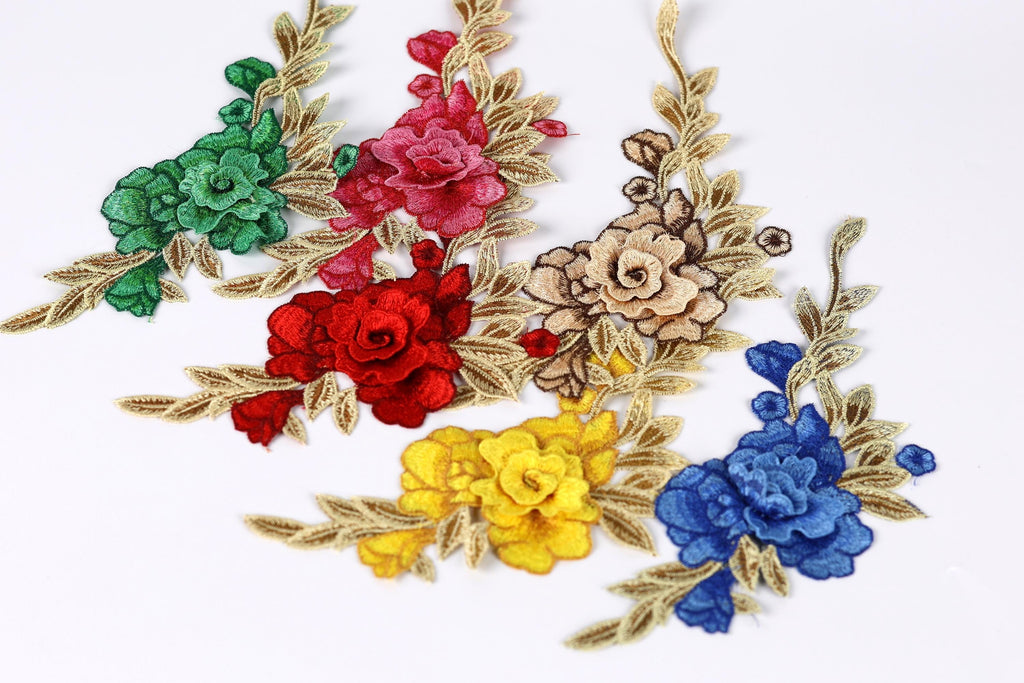 a collection of colorful floral embroidery pieces, including red, pink, yellow, blue, and green flowers, arranged on a white background.