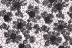 a close-up view of a black and white floral pattern with intricate designs and textures.