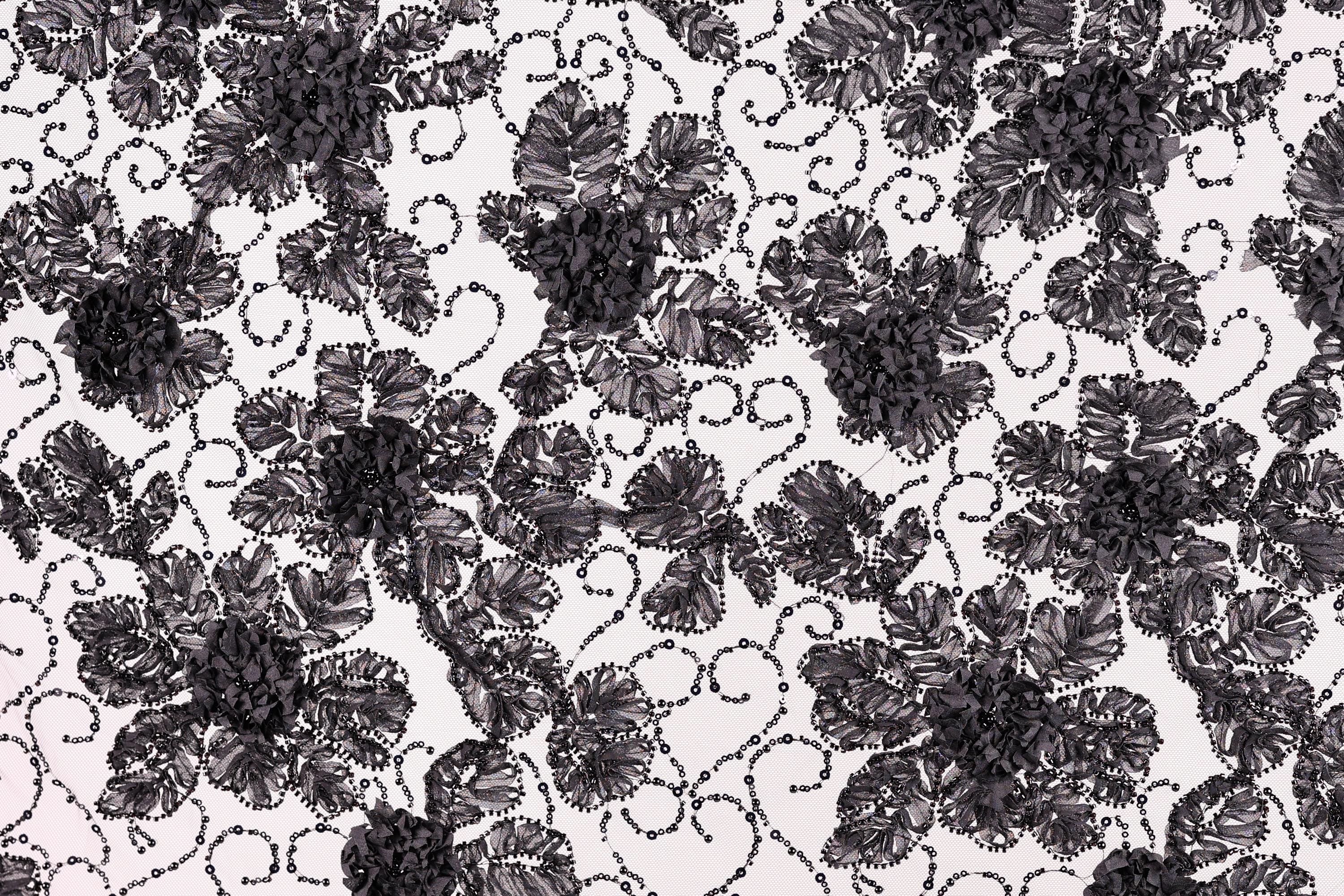 a close-up view of a black and white floral pattern with intricate designs and textures.