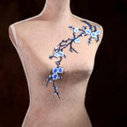 A mannequin with a delicate floral embroidery on its shoulder.