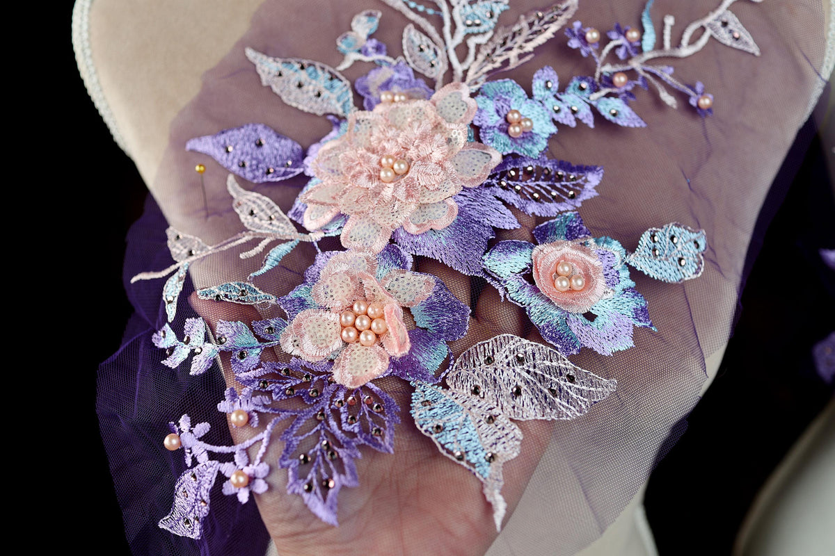 a person holding a bouquet of flowers in their hand
