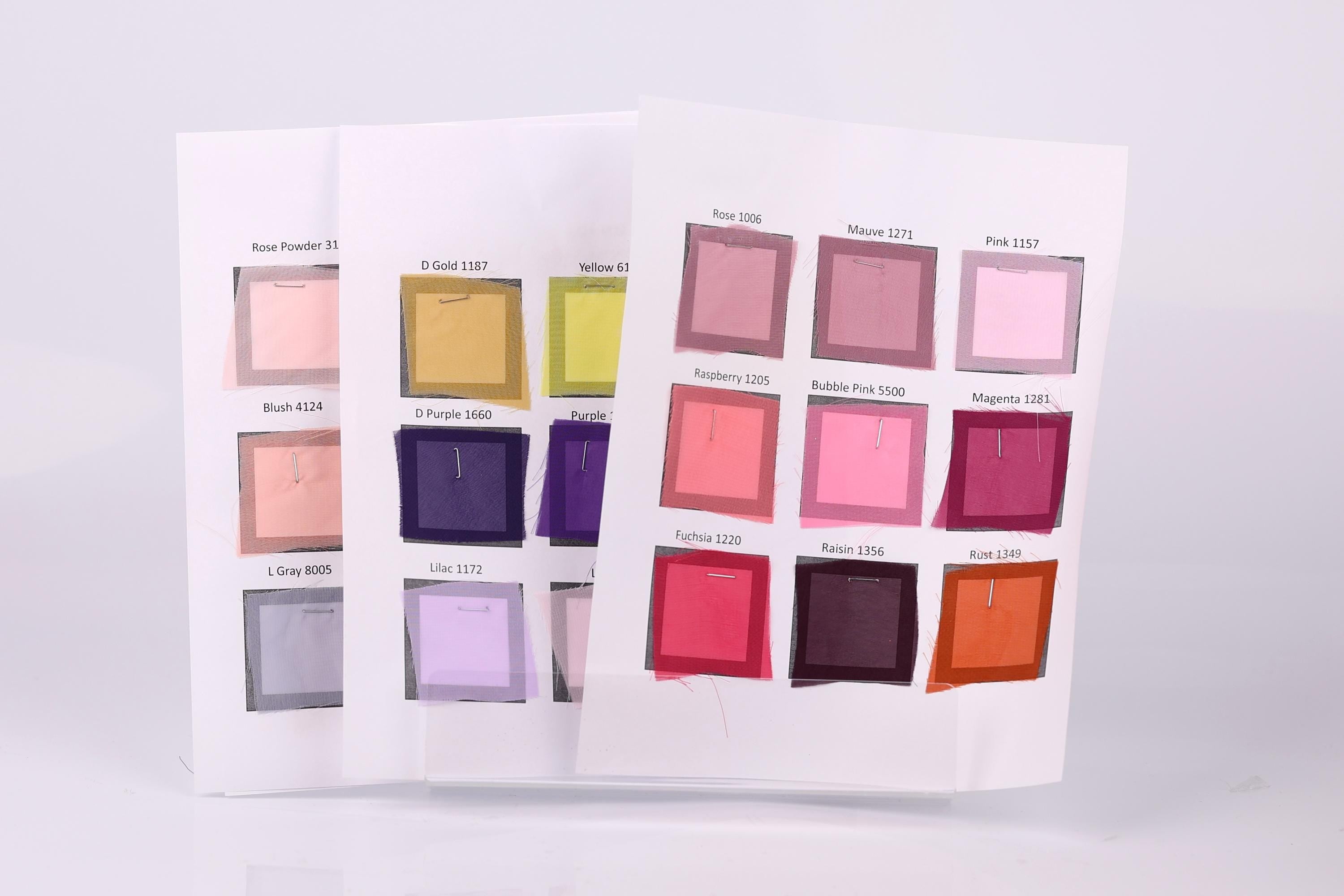 a collection of fabric swatches, each displaying a different color. The swatches are arranged in a grid format, with each row representing a different color and each column representing a different swatch. The swatches are spread across a white background, creating a visually appealing and organized display.