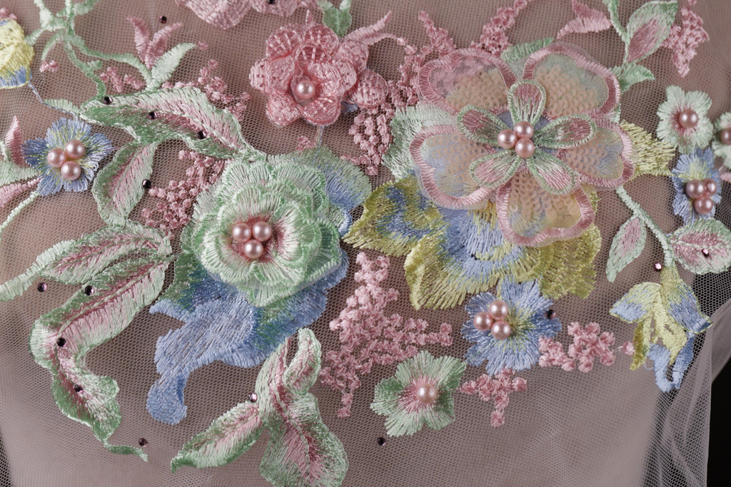 a close up of a dress with flowers on it