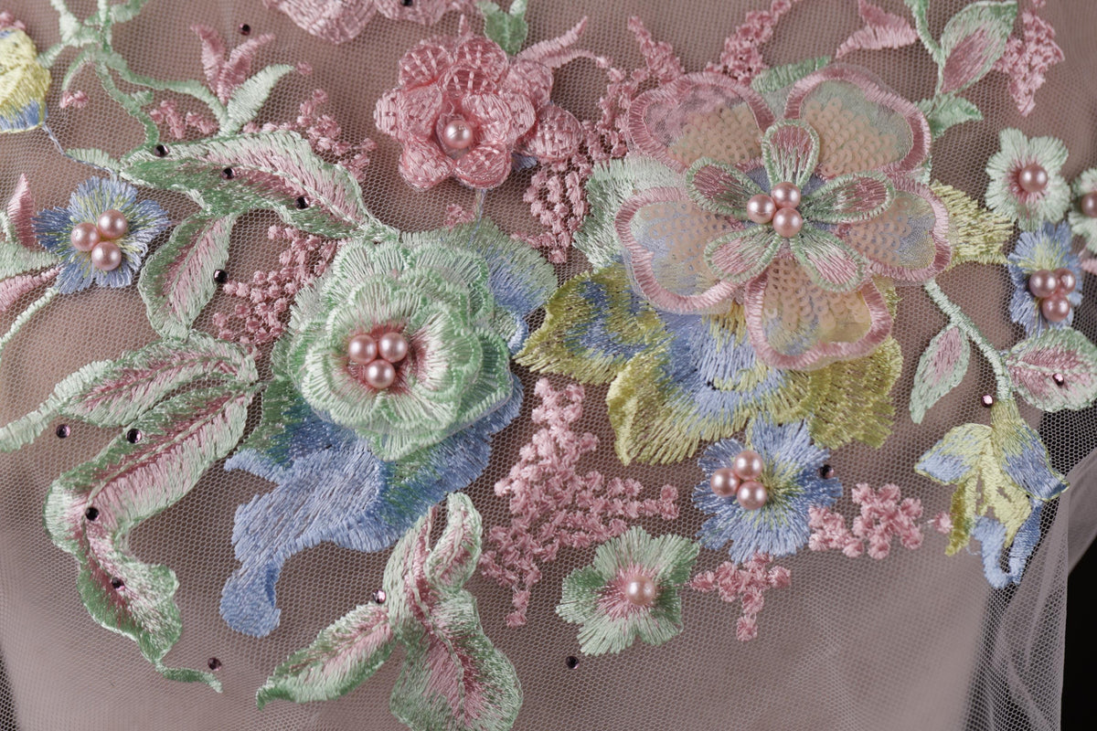 a close up of a dress with flowers on it