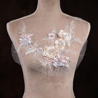 A mannequin with a delicate floral embroidered on its chest.