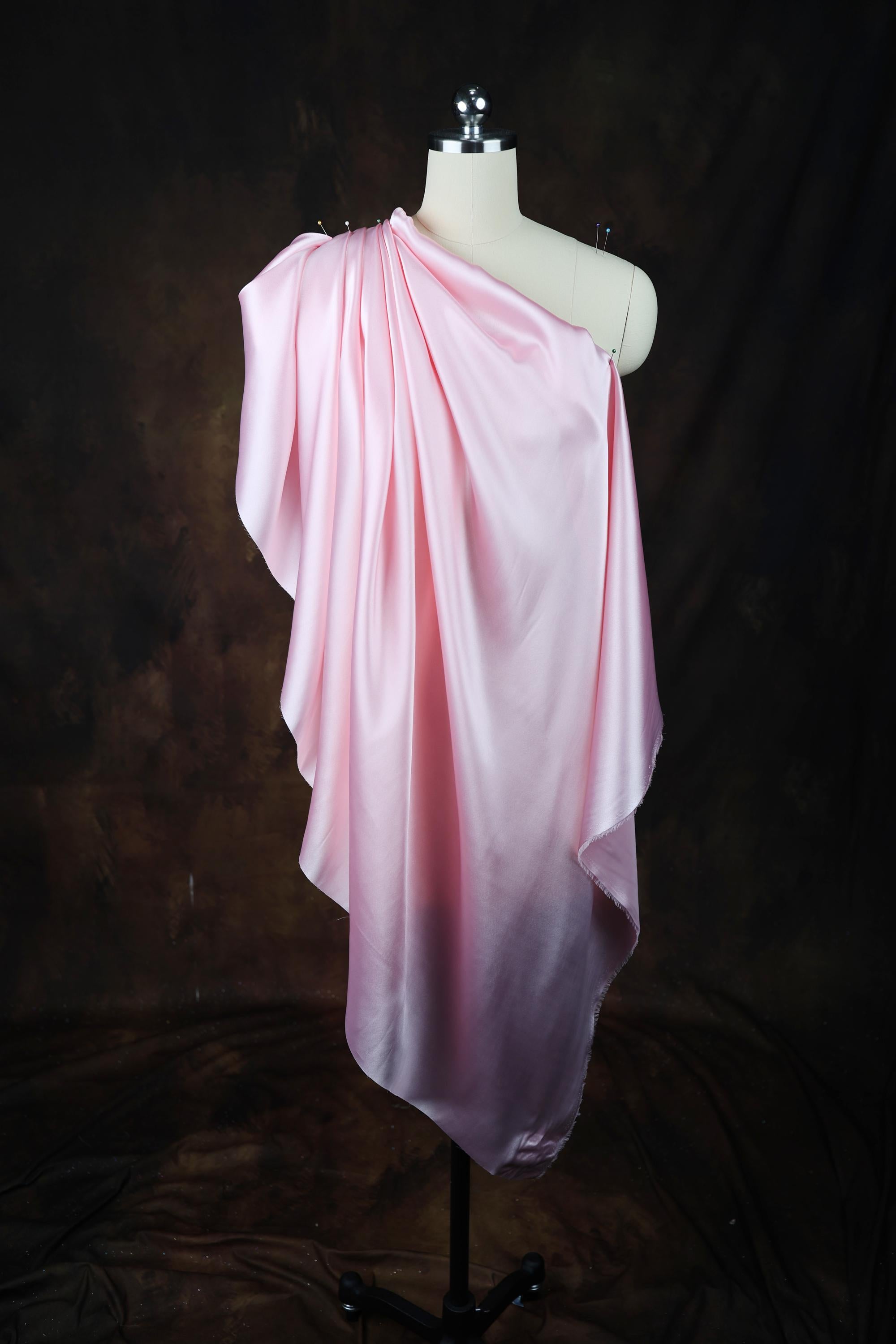 a dress on a mannequin on a black background