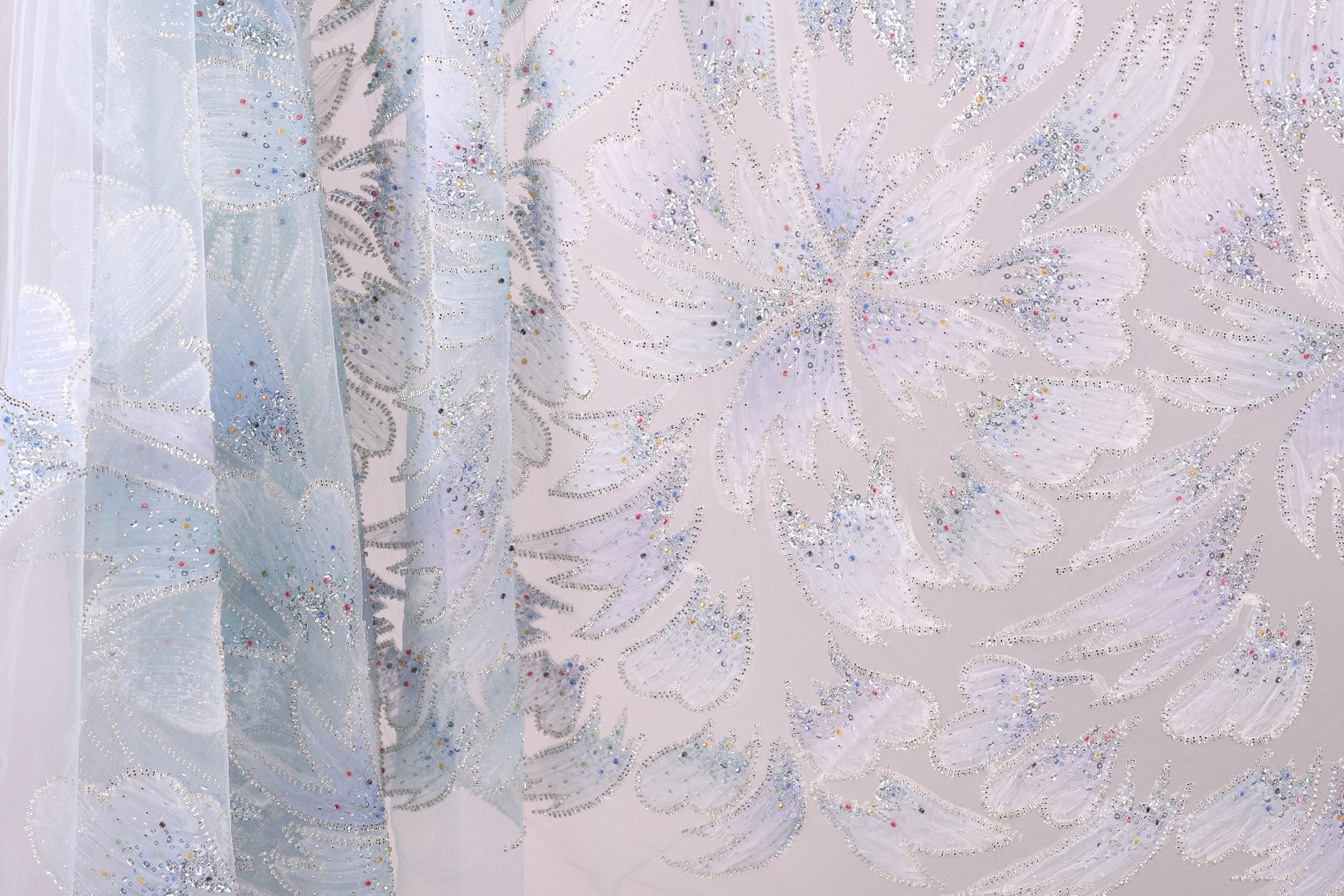 a close-up view of a fabric with a floral pattern, showcasing the intricate details and textures of the design.