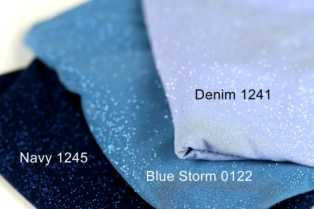 three fabric swatches, each with a different color and texture. The topmost fabric is navy blue, the middle one is a light blue with sparkles, and the bottom one is a light purple. The text labels the fabric swatches as Navy 1245, Blue Storm 0122, and Denim 1241.