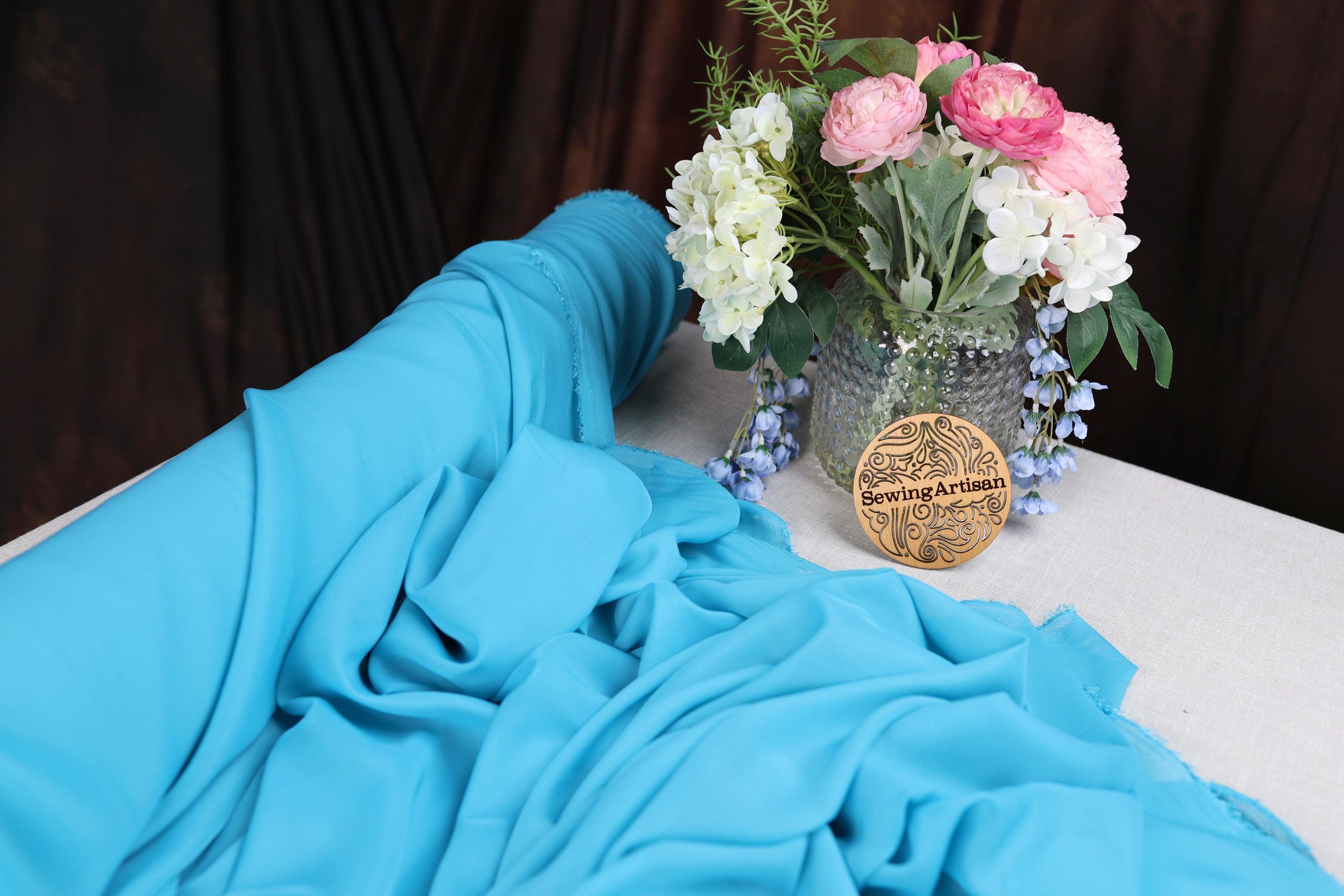 a vase filled with flowers sitting on top of a table