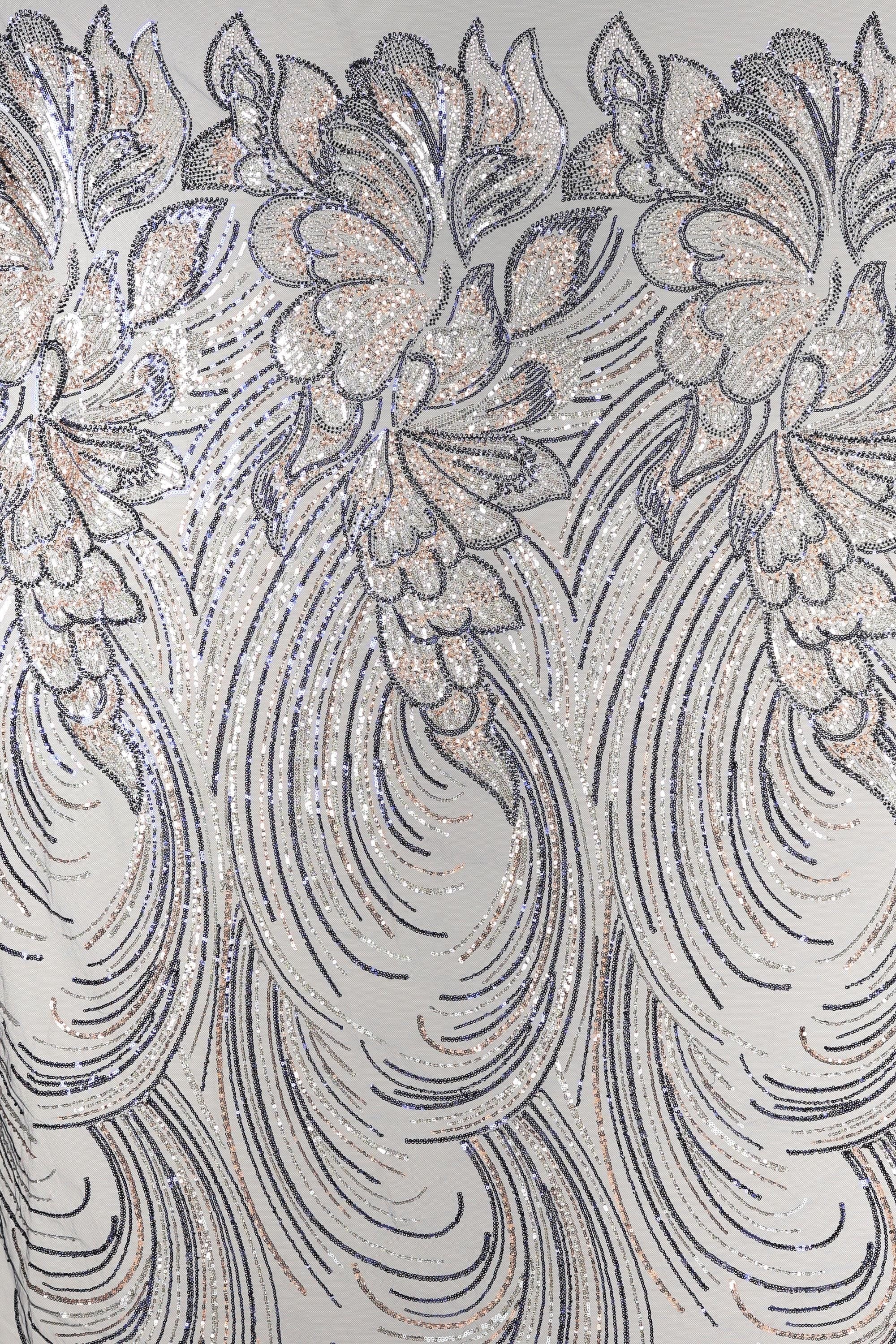 a close-up view of a fabric with a repeating pattern of intricate floral designs in shades of gray and white, accented with gold glitter. The pattern is composed of curved lines and swirls, creating a sense of movement and elegance. The fabric appears to be a type of sheer material, suitable for various applications such as clothing or home decor.