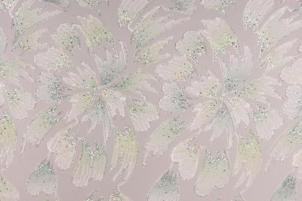 a repeating pattern of white and green flowers with glittering details, creating a visually striking and intricate design.