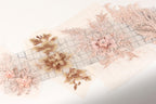 a collection of delicate, intricate floral embroidery pieces, including a large pink flower and smaller pink flowers, arranged on a white background.