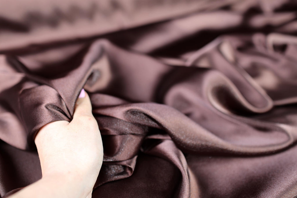 a person is holding a piece of cloth