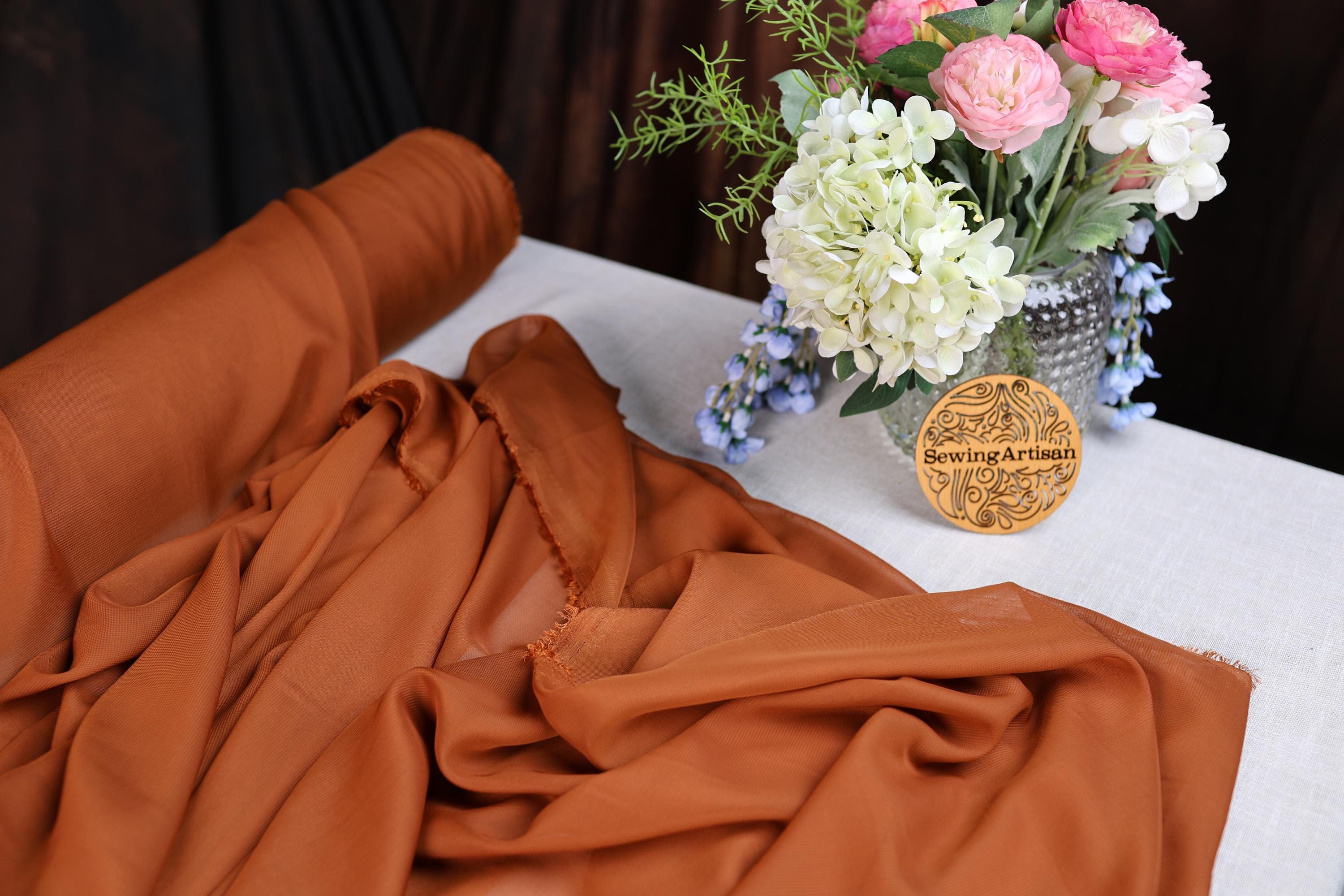 a vase of flowers sitting on top of a table