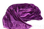 a close-up view of a purple velvet fabric, with its folds and creases visible.