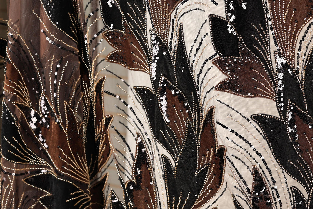 a close-up view of a fabric with a floral pattern, showcasing intricate details and a rich, multicolored design.