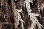 a close-up view of a fabric with a floral pattern, showcasing intricate details and a rich, multicolored design.