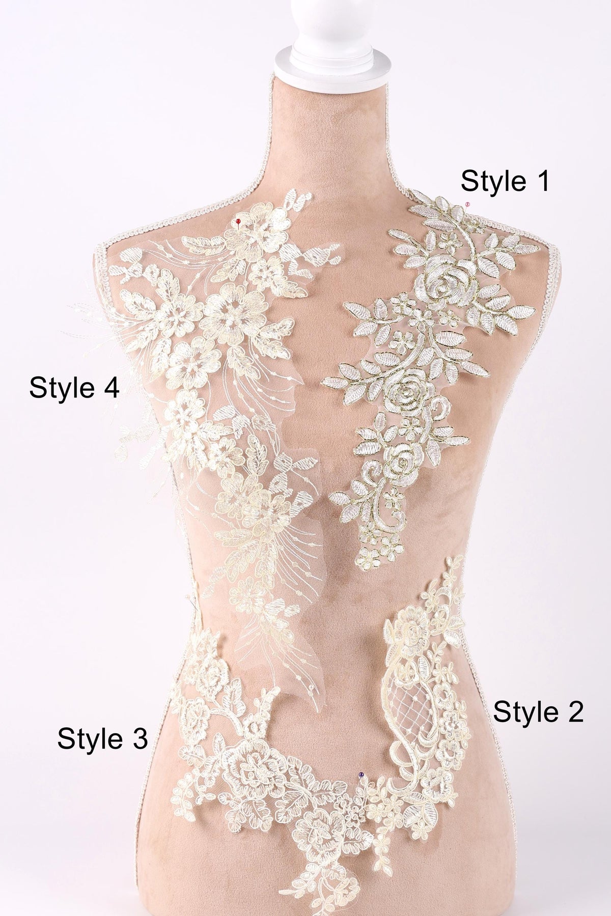 A mannequin with various styles of lace and floral embroidery displayed on its bust.
