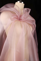 a dress on a mannequin with a pink bow
