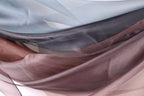 a close-up view of a fabric with a variety of colors and textures, including shades of blue, gray, brown, and pink.