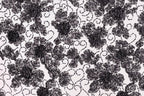 a close-up view of a black and white floral pattern with intricate designs and textures.