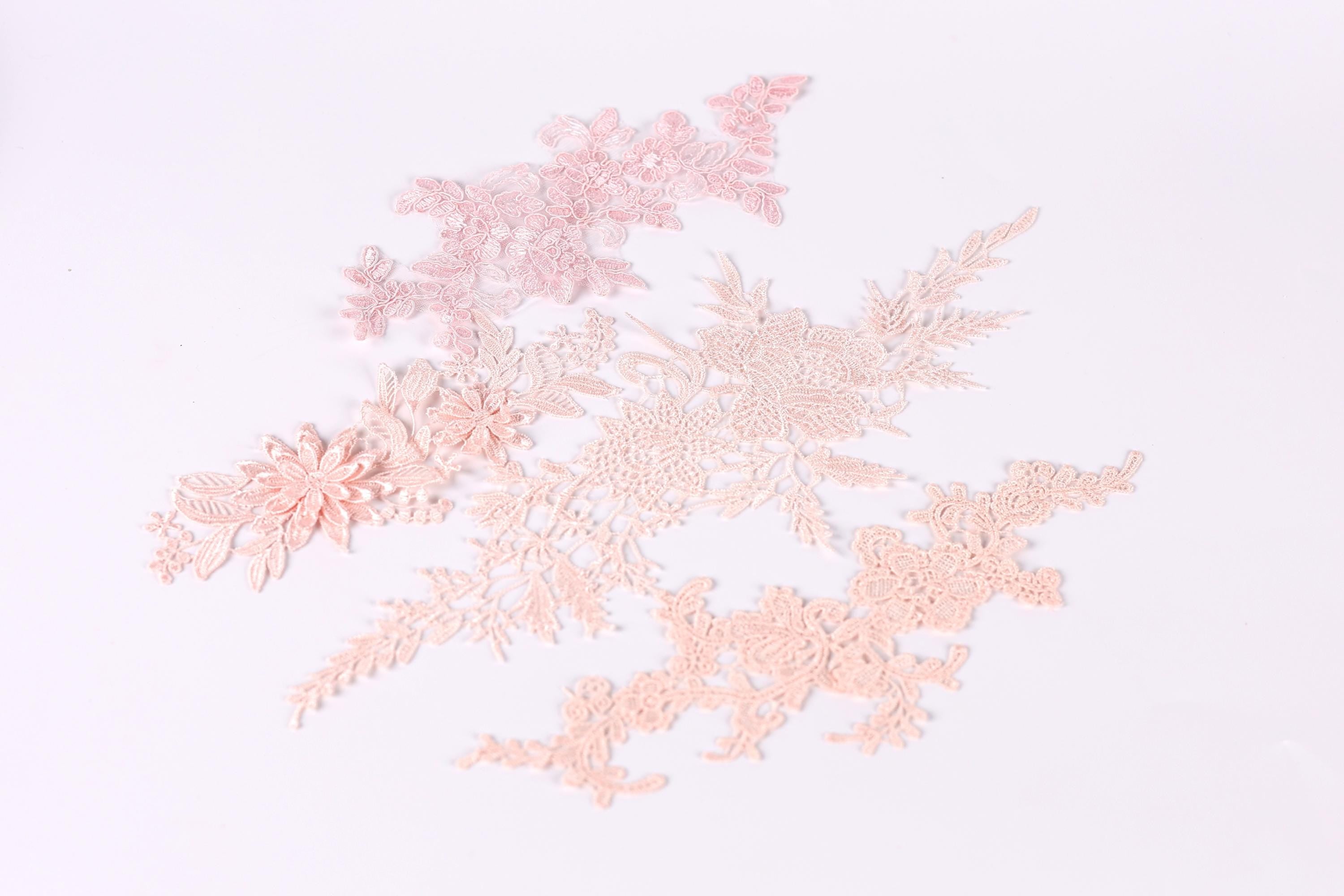 delicate pink and peach-colored floral patterns, including flowers and leaves, arranged in a visually appealing manner.